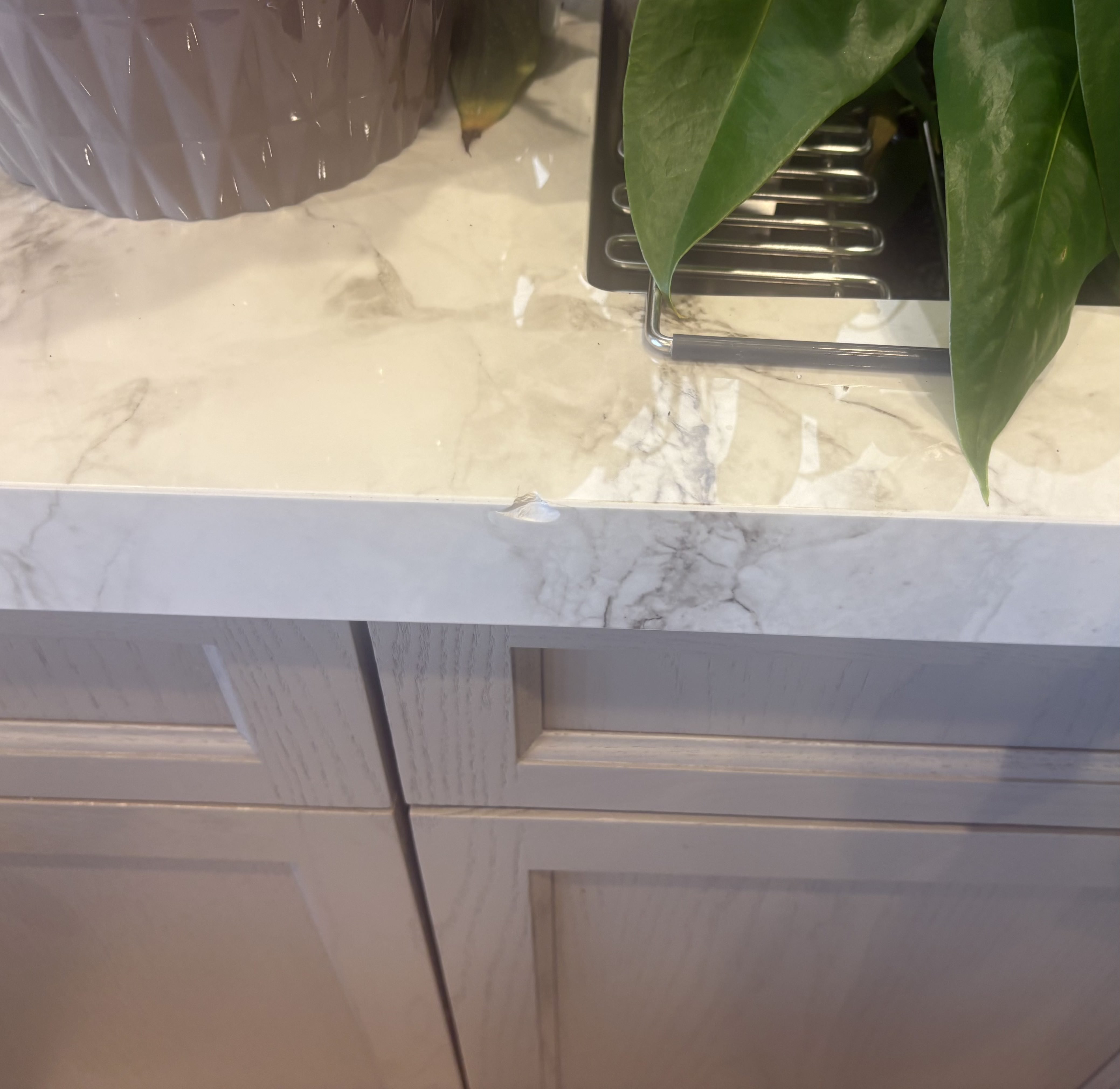 Chipped Dekton porcelain countertop before repair