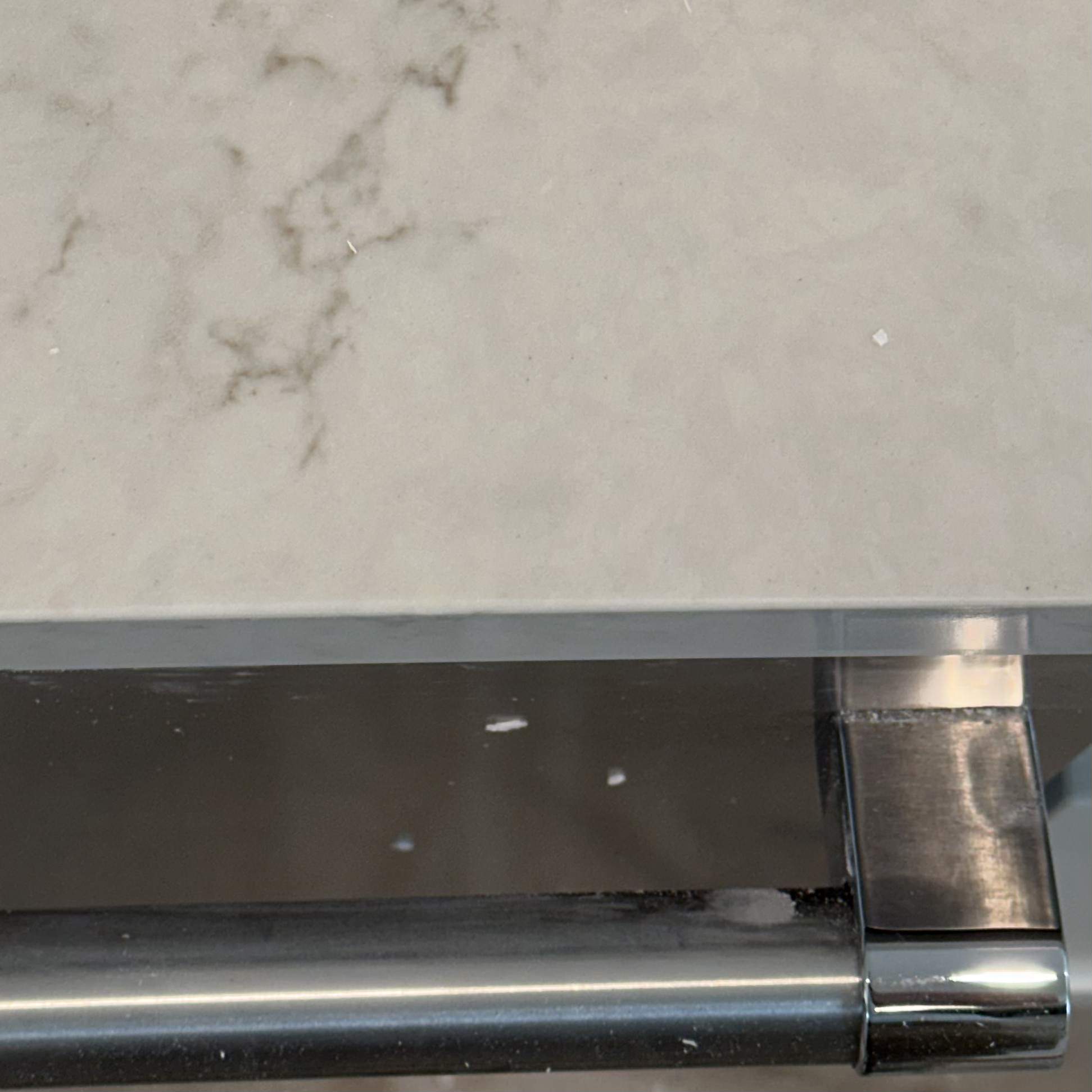 Countertop after cleanout of failed repair, refilled flush and color matched
