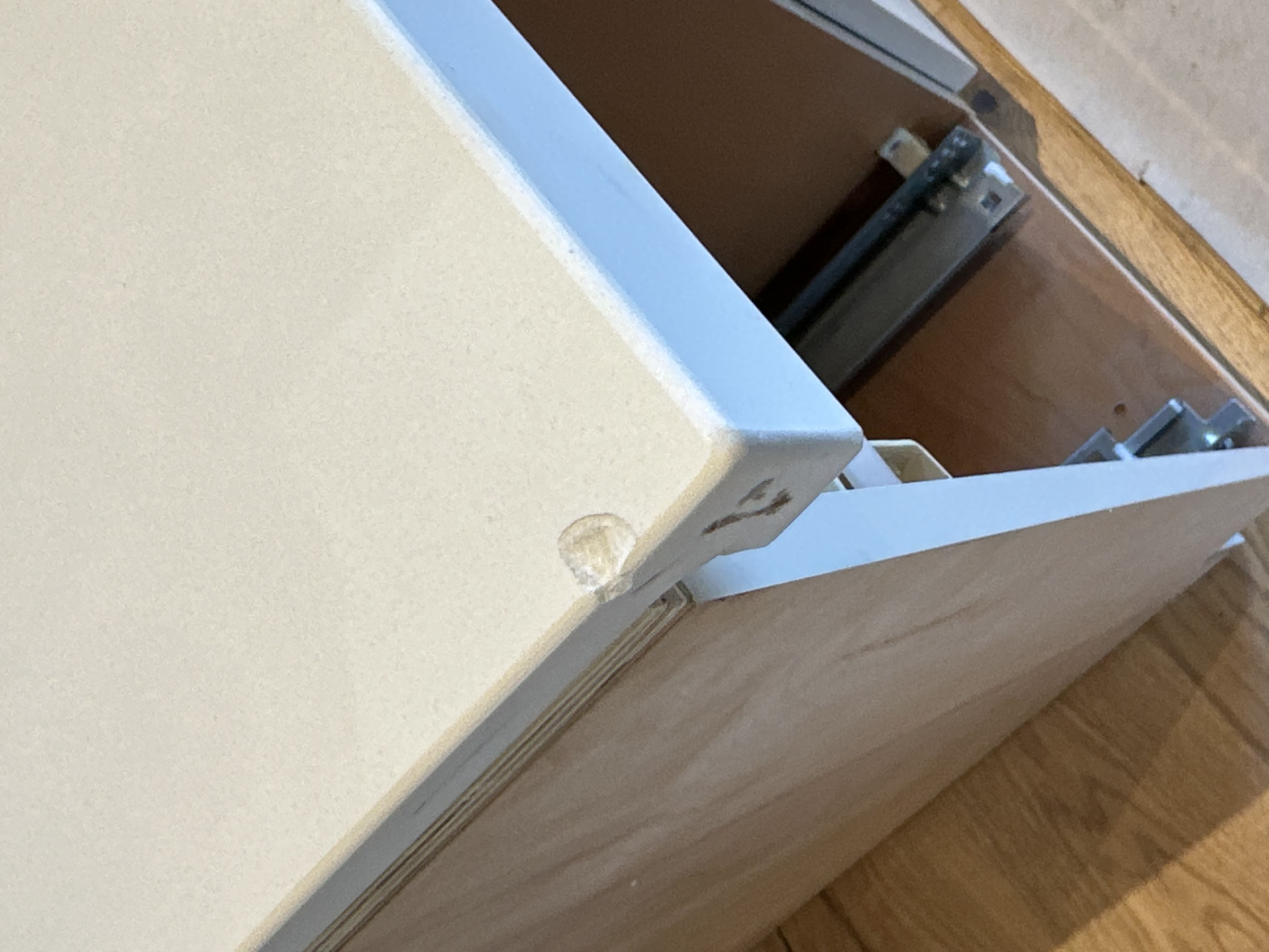 Chipped quartz countertop corner before repair