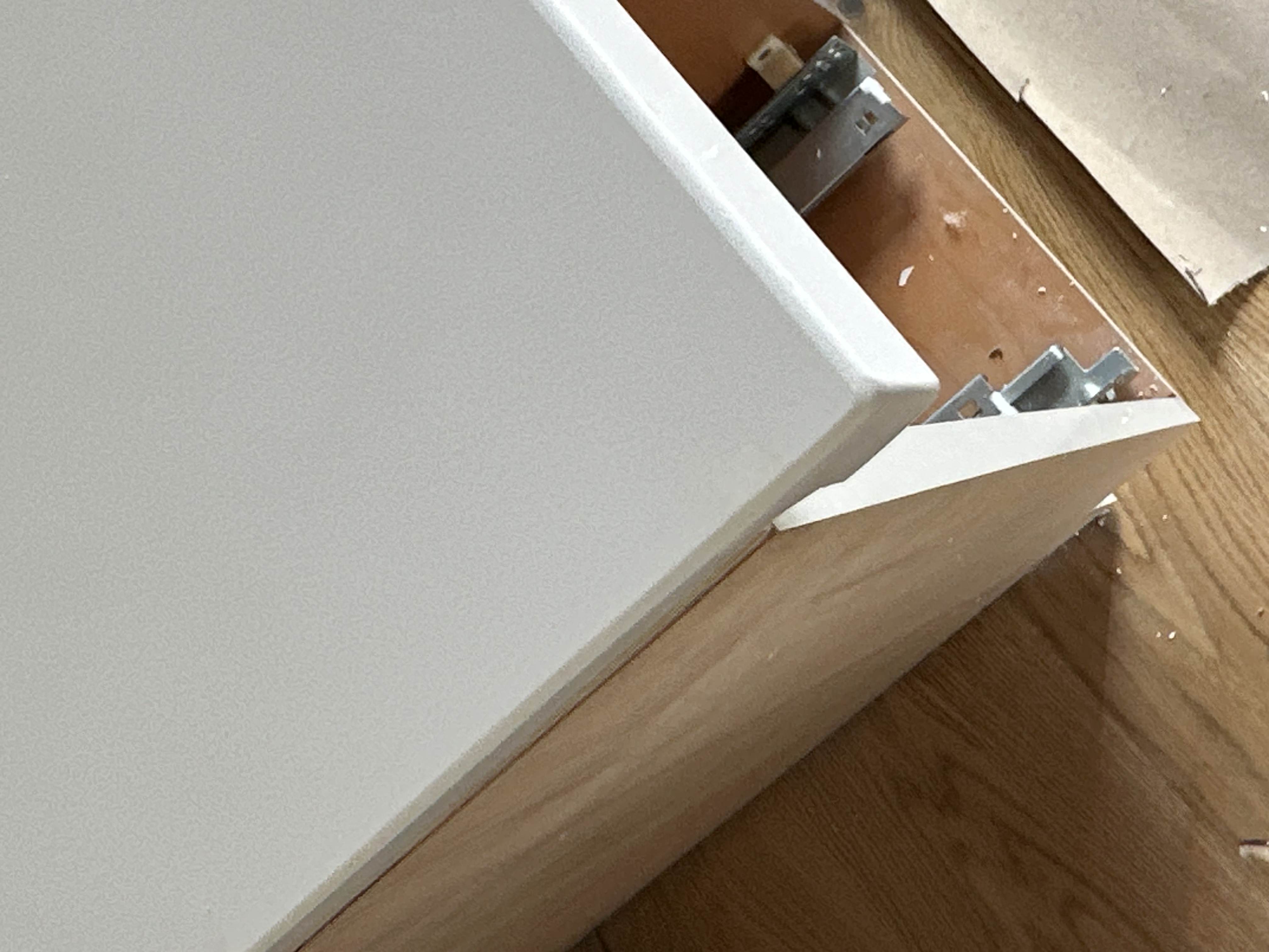 Quartz countertop corner after chip repair, filled flush and color matched